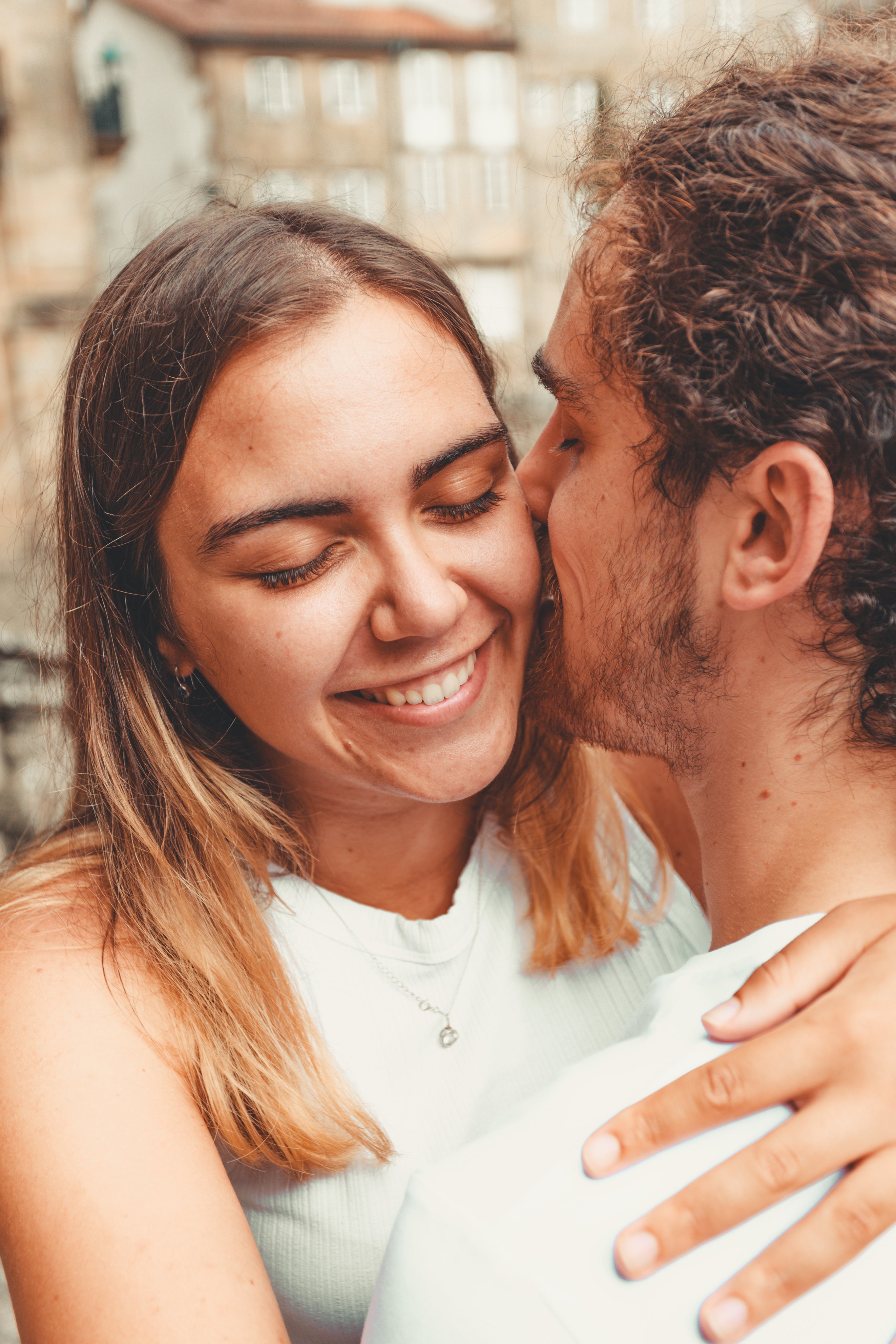files/woman-smiles-wide-with-her-face-close-to-a-man.jpg